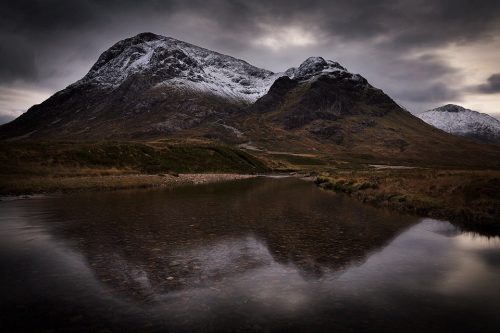 This moody image of Buachaille Etive Mòr reflected in the river Etive. It took a while to find a calm stretch of river to achieve this image, but I really like this classic composition, especially with a dusting of snow on the tops.