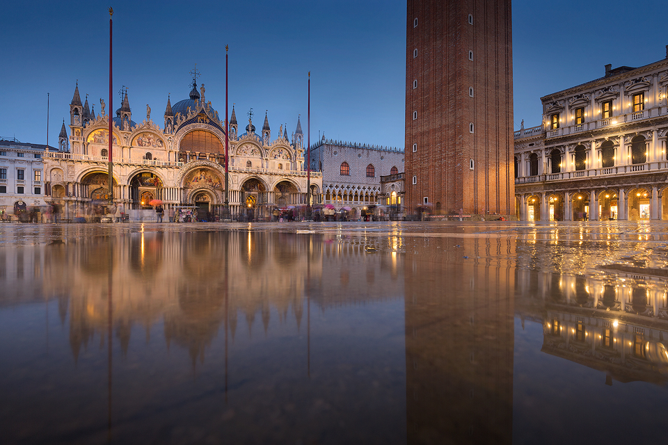 St Mark's Basilica in the blue hour, taken during a particularly wet visit to the beautiful Italian city of Venice. Although it was a holiday rather than a work trip, I still brought my camera and one lens along to do some photography. We managed to avoid floods for most of the trip, but on the last day the torrential rain started again. The heavy rain did make this image of St Mark's square reflected in a large puddle possible, but also meant we got caught out with no waterproof footwear, not much fun getting the return plane with sodden shoes and socks!