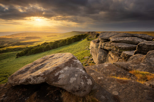 Golden Horizons: Sunset Magic at Stanage Edge. A dramatic mid summer sunset from Stanage Edge, looking towards stanage plantation.