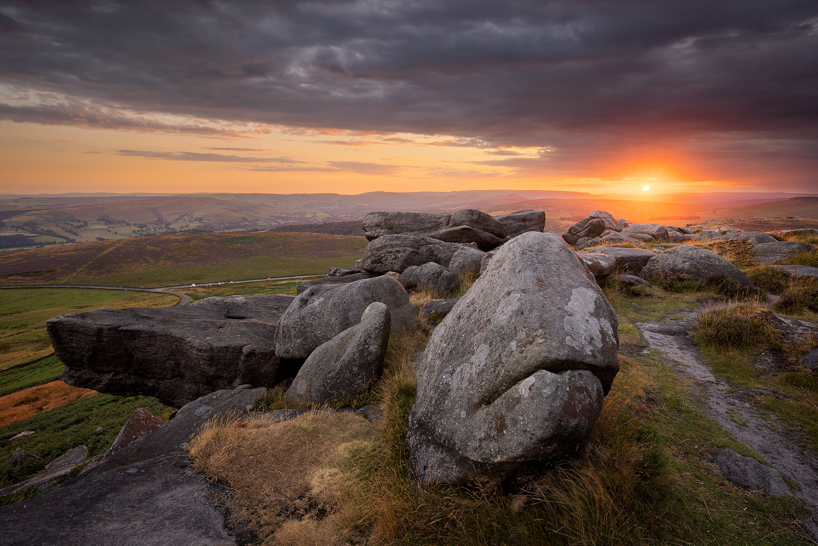 A dramatic mid summer sunset from Stanage Edge, looking towards the Hope Valley. 