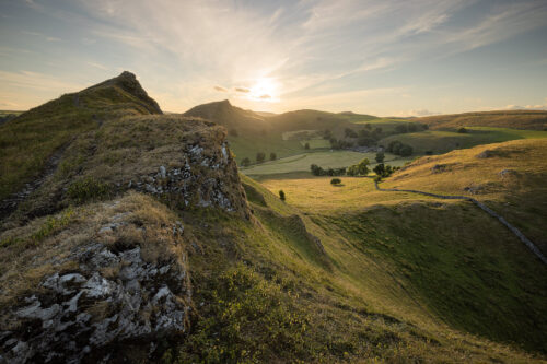 Summer sunset from Parkhouse Hill summit looking towards Chrome hill. the sweeping rural views from here are easily one of the best in the Peak District.